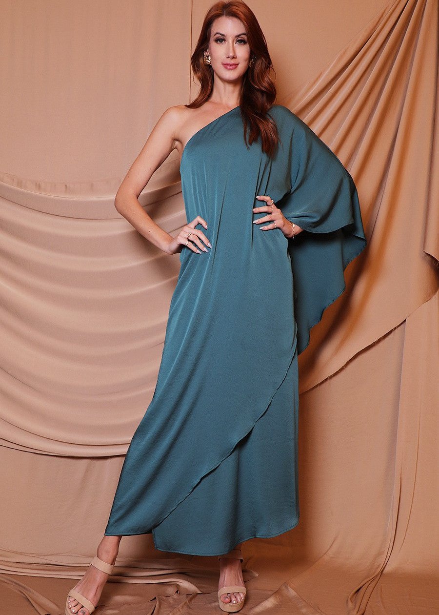 Hunter green one shoulder maxi dress. The one shoulder is timeless and falls to the wrist, keeping you covered and ready for anything that come your way.