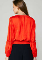 Load image into Gallery viewer, Flame long sleeve neck blouse with pleated detail on sleeve and smocked detail on hem and shoulder.
