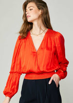 Load image into Gallery viewer, Flame long sleeve neck blouse with pleated detail on sleeve and smocked detail on hem and shoulder.
