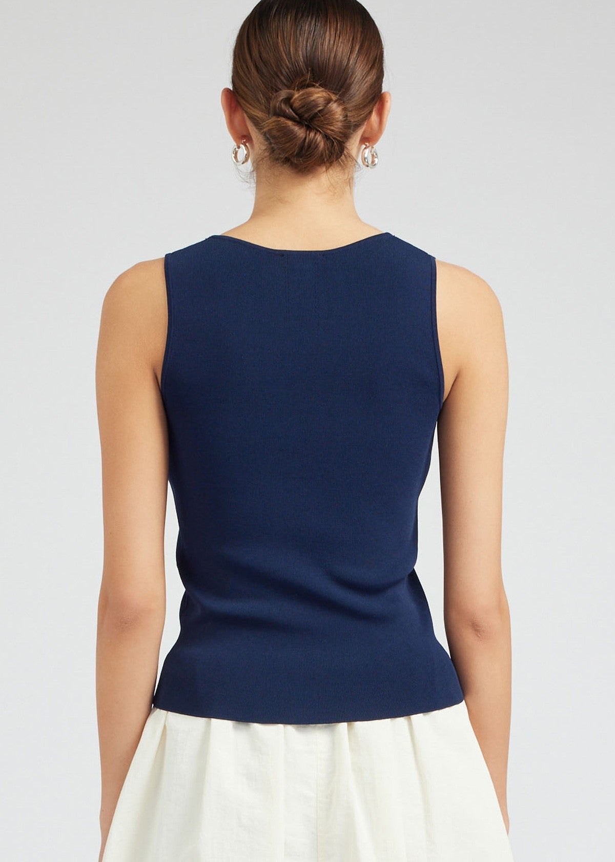 Navy sleeveless v-neck sweater top.