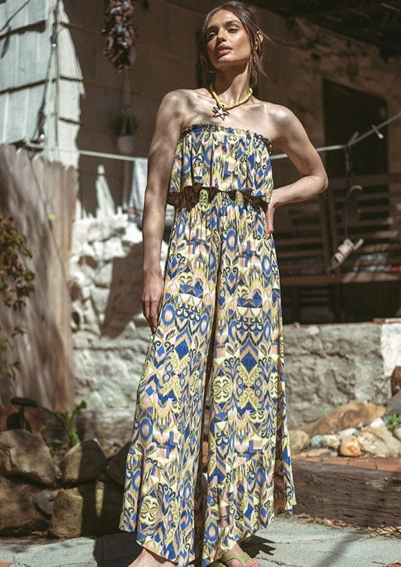 Printed Wide Leg Tube Jumpsuit. Tube jumpsuit - tropical print - smocked bodice - ruffles - a straight neckline - wide legs - elastic waistband