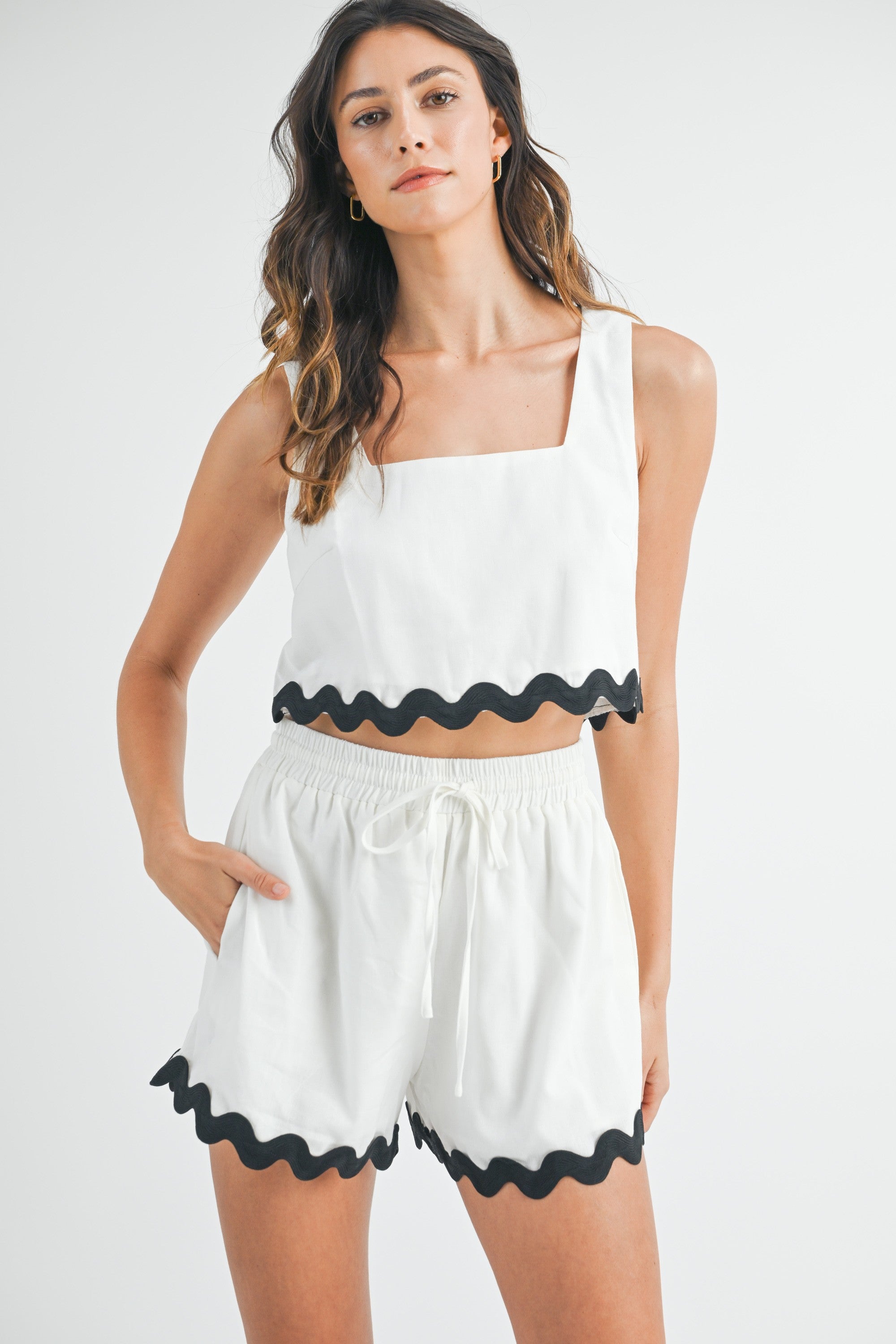 Off white rickrack trimmed sleeveless square neckline crop top and matching elastic waistband short set. Shorts have lining.