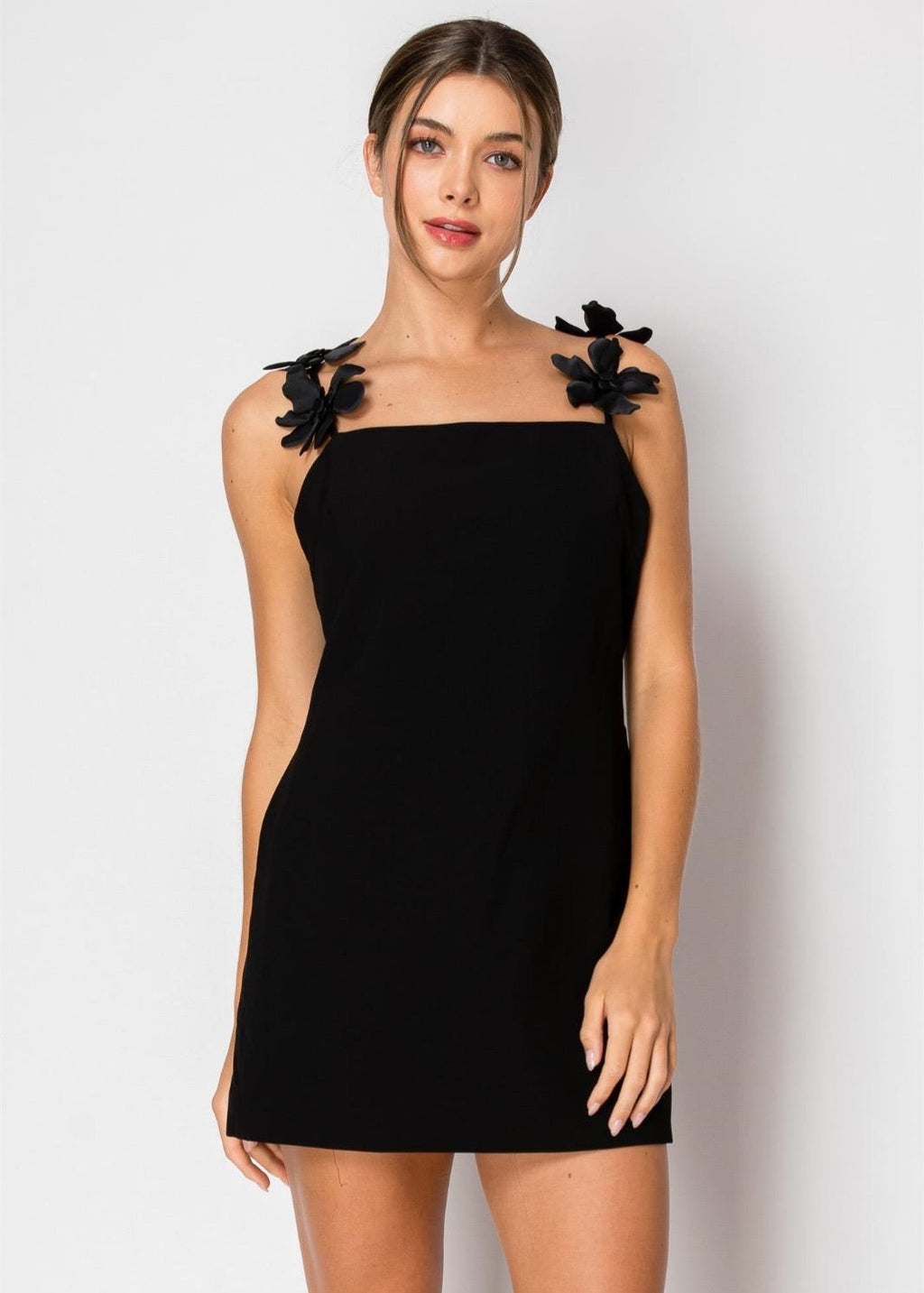 Little black dress with floral trap detailing.