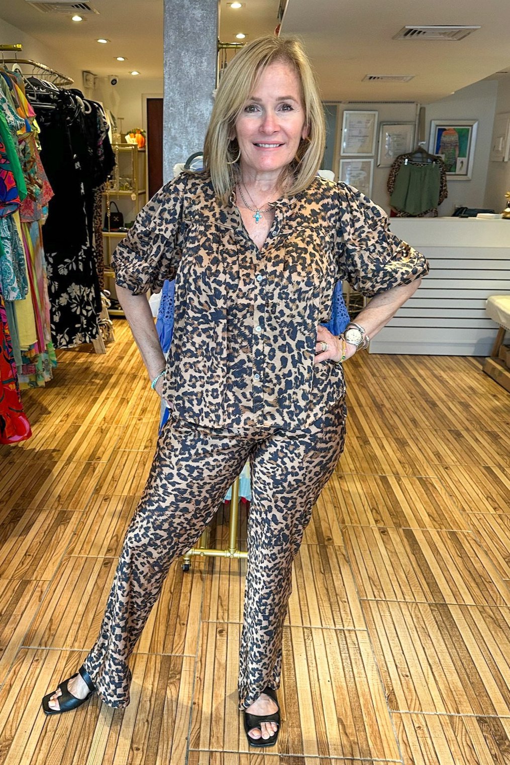 Leopard print two piece set. Leopard pants with matching button up short sleeve top. Everything animal print is super in and this set is no exception.