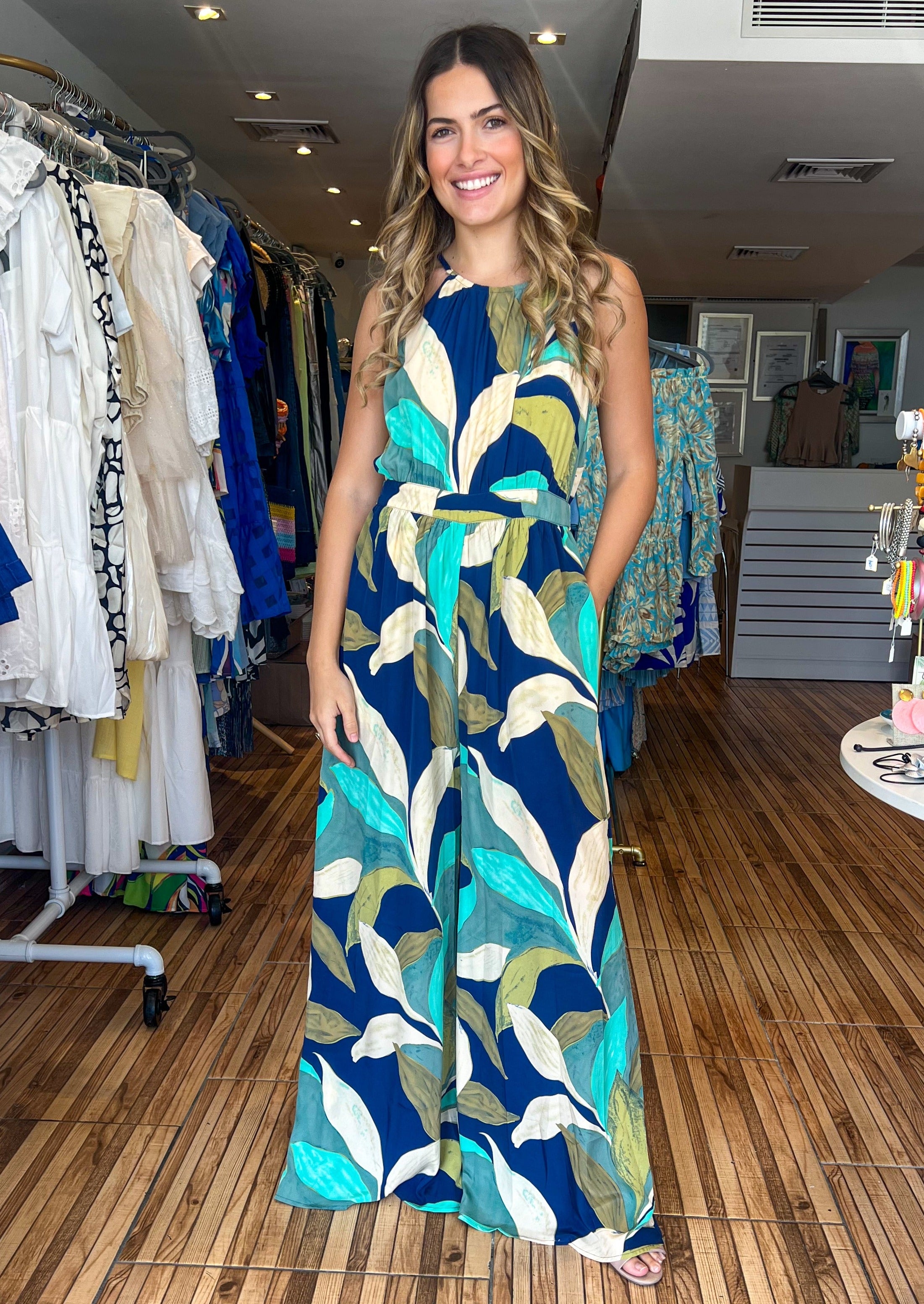 Navy print halter jumpsuit with adjusted waist, pockets and lining.&nbsp;